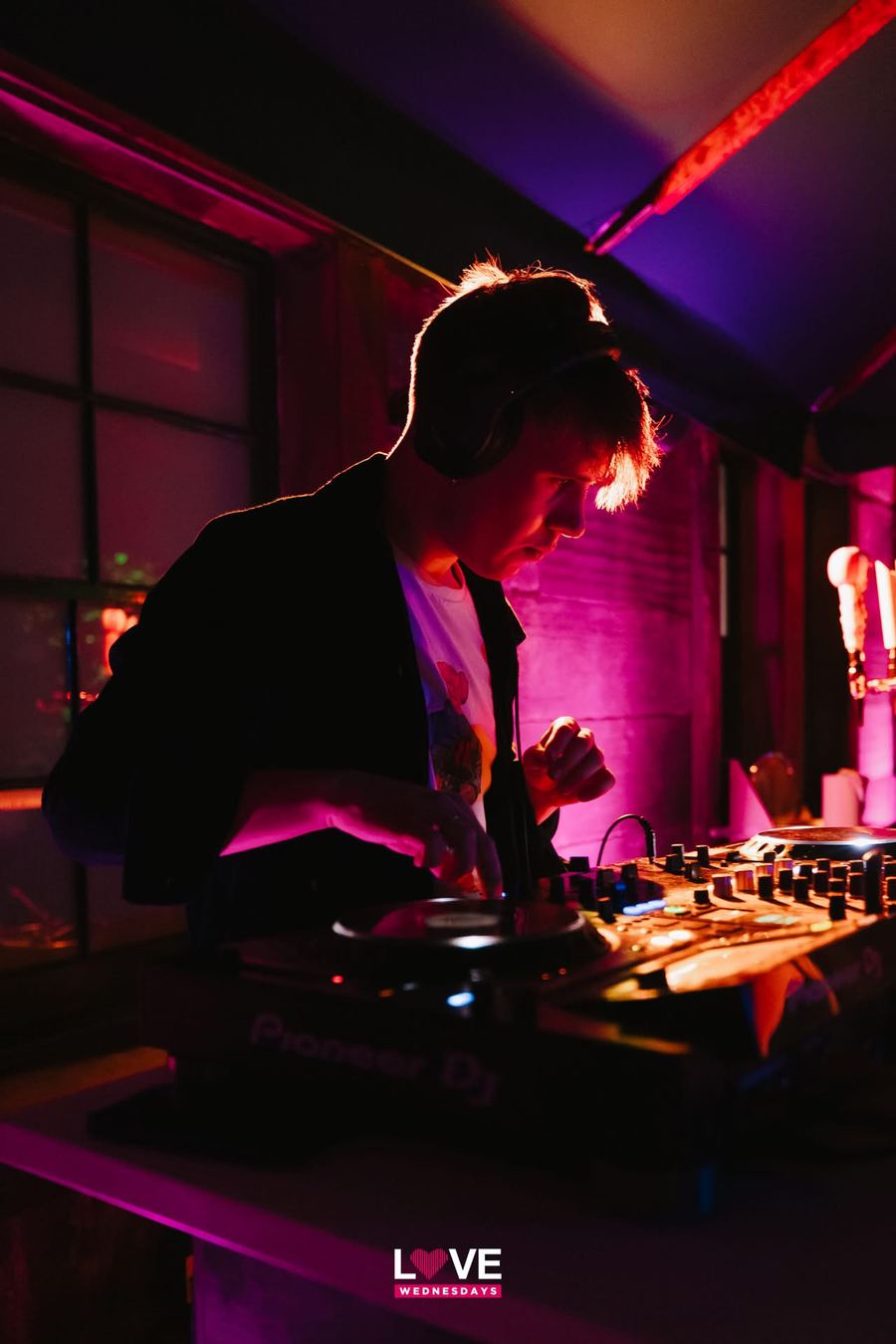 Dougal at the decks under pink lights